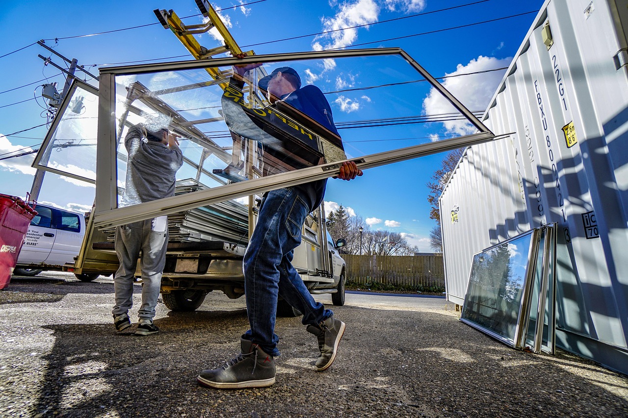 Professional movers carrying boxes for residential moving